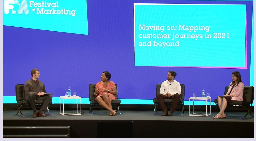 Ben Davis speaks to Chi Evi Parker Rav Dhaliwal and Inés Ures on a stage at the Festival of Marketing