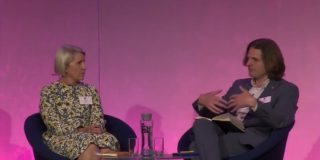 Specsavers' Tina Christison and Econsultancy's Steffan Aquarone sit on-stage at Econsultancy Live.