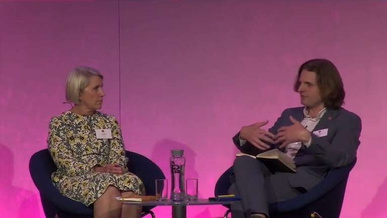 Specsavers' Tina Christison and Econsultancy's Steffan Aquarone sit on-stage at Econsultancy Live.