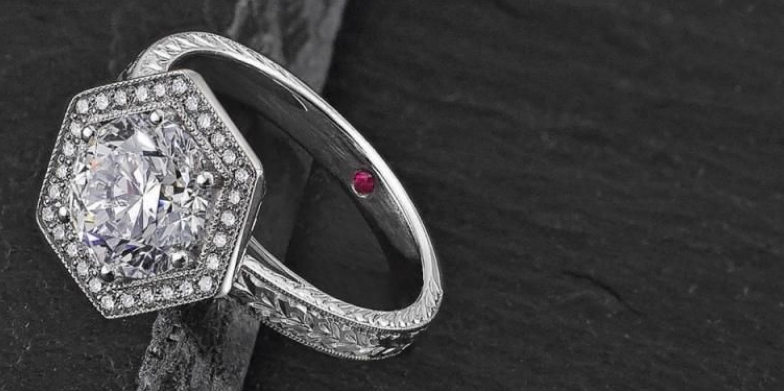 A diamond ring on a dark gray background