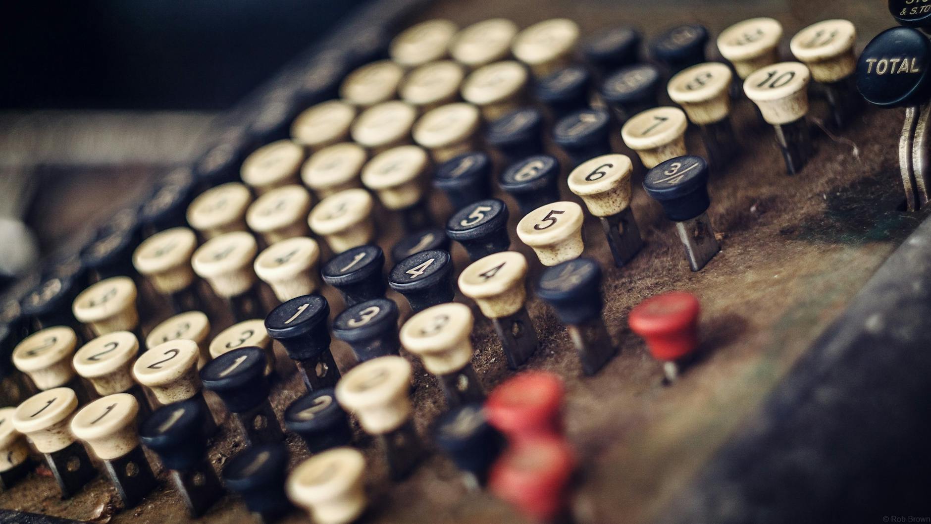 Selective Focus Photography of White and Black Control Buttons