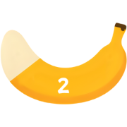 Bright yellow banana peel curved into a crescent with the number 2 on it.